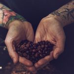 thumb_ROAR Coffee man holding coffee beans