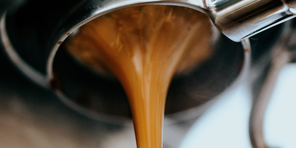 ROAR Coffee coffee coming out of the coffee machine
