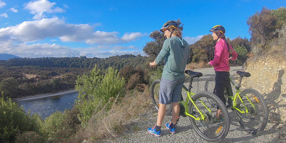 bike riders contemplating the view at Fiordland bike trail