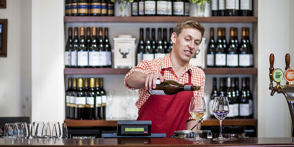 Real NZ TSS Earnslaw barmen pouring wine